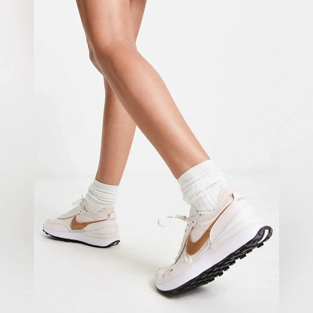Nike Women's Sneakers in White with Metallic Rose Gold Swoosh